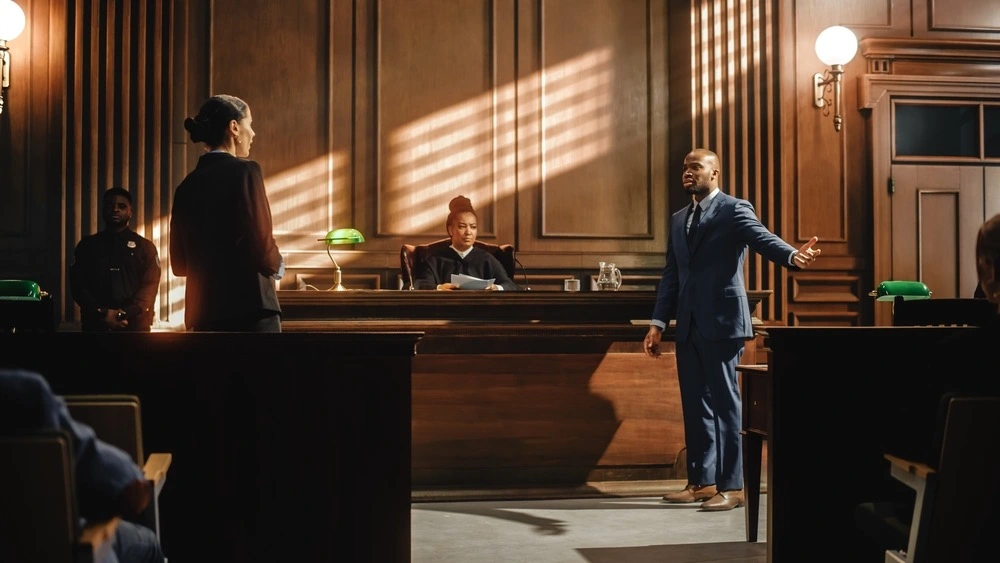 A determined medical malpractice lawyer passionately advocates for their client in a tense Chicago courtroom trial