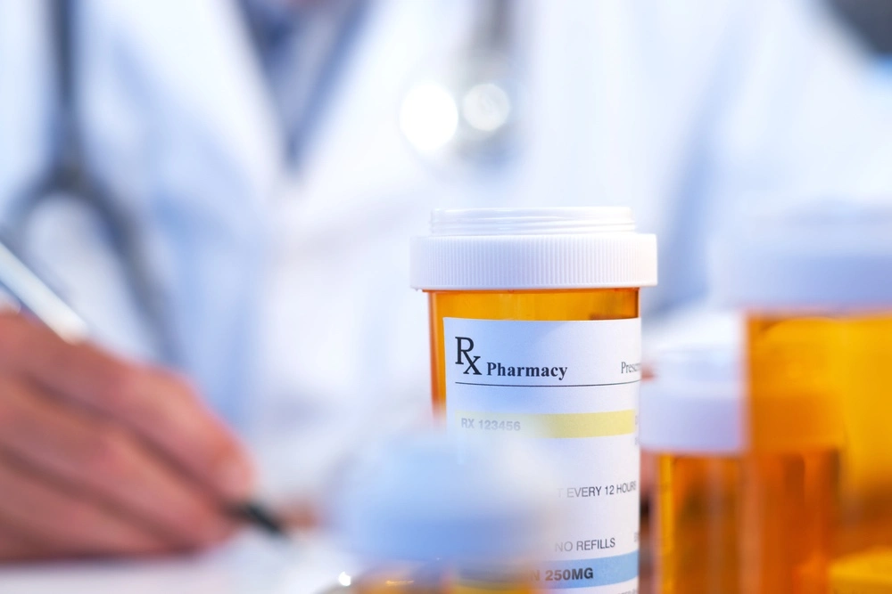 A bottle of wrongly prescribed medication stands on a table, epitomizing a medical error and highlighting the crucial need for the best Baltimore malpractice lawyer