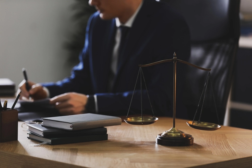 A lawyer reviews a case in a Chicago office, highlighting the importance of securing a skilled medical malpractice attorney in Illinois