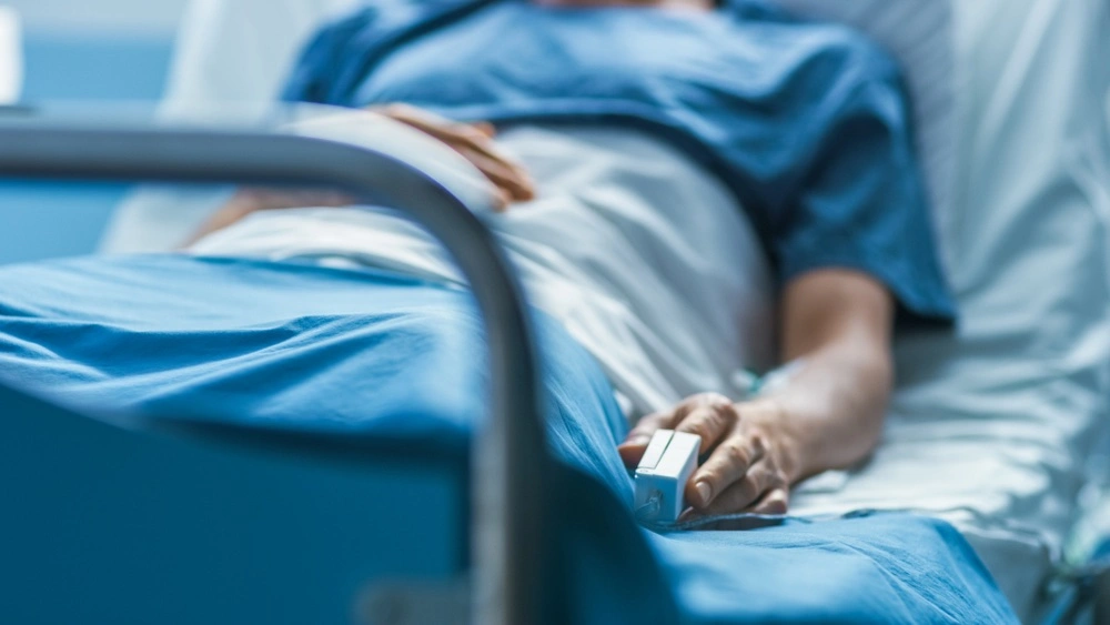 A patient lies in a hospital bed, a reminder of the importance of understanding one's rights to pursue a medical malpractice claim