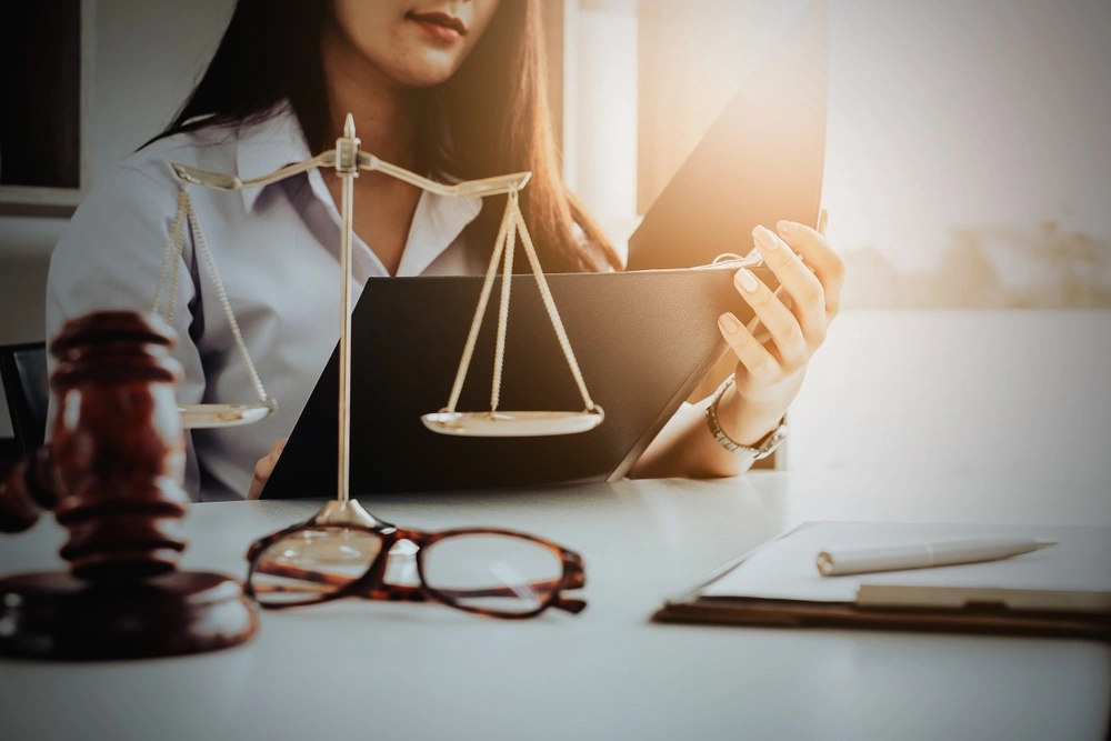 In a Texas office, a focused medical malpractice lawyer reviews case documents, meticulously preparing to sue for negligence