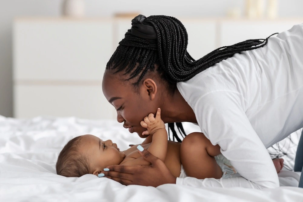 A newborn baby is gently examined by a medical professional in Chicago, underscoring the vigilant attention to potential birth injury medical malpractice