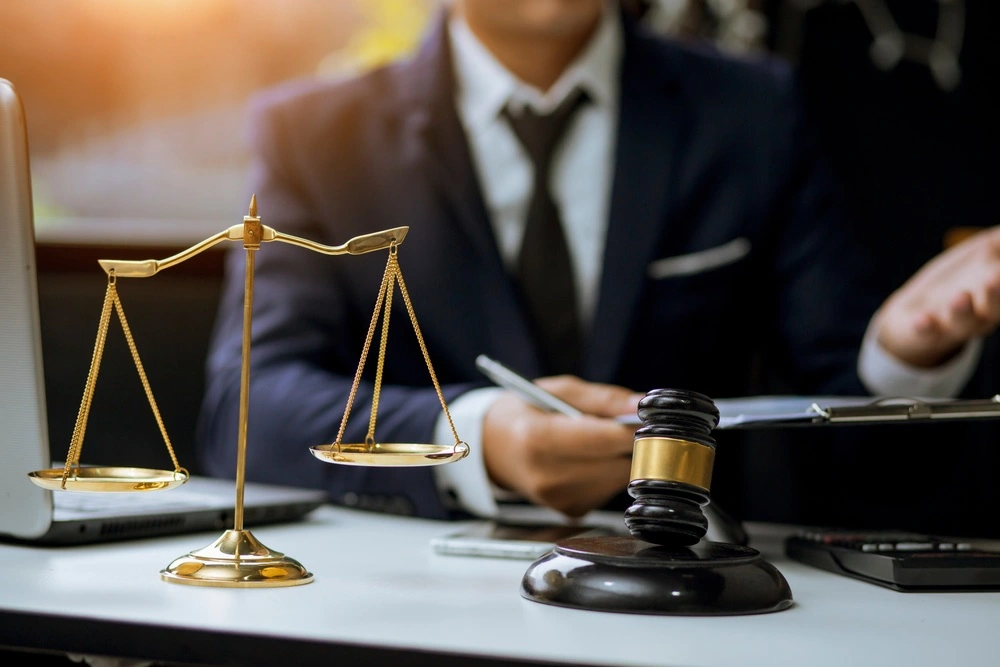  A Baltimore personal injury lawyer sits across from a client, offering expert guidance through the complexities of a negligence case