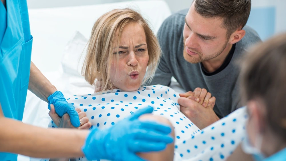 In a Texas hospital, a woman in labor highlights the critical issue of defective medical equipment's role in contributing to birth injuries